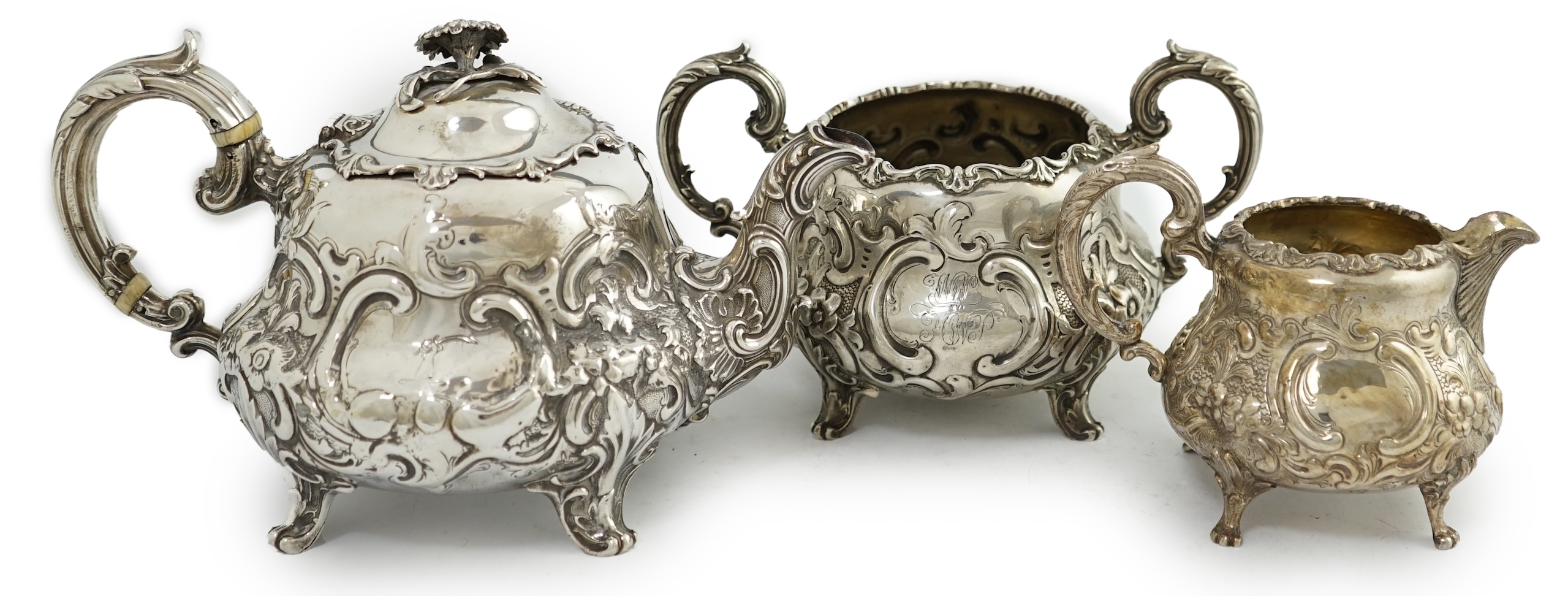 A matched Victorian and later silver three piece tea set